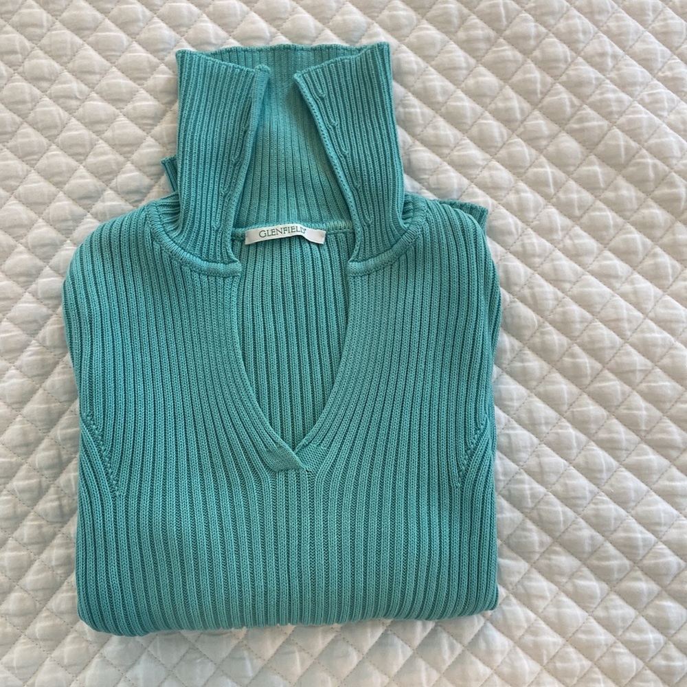 Ribbed knit pullover sweater. Made in Italy. Sun washed aquamarine cotton. Vneck